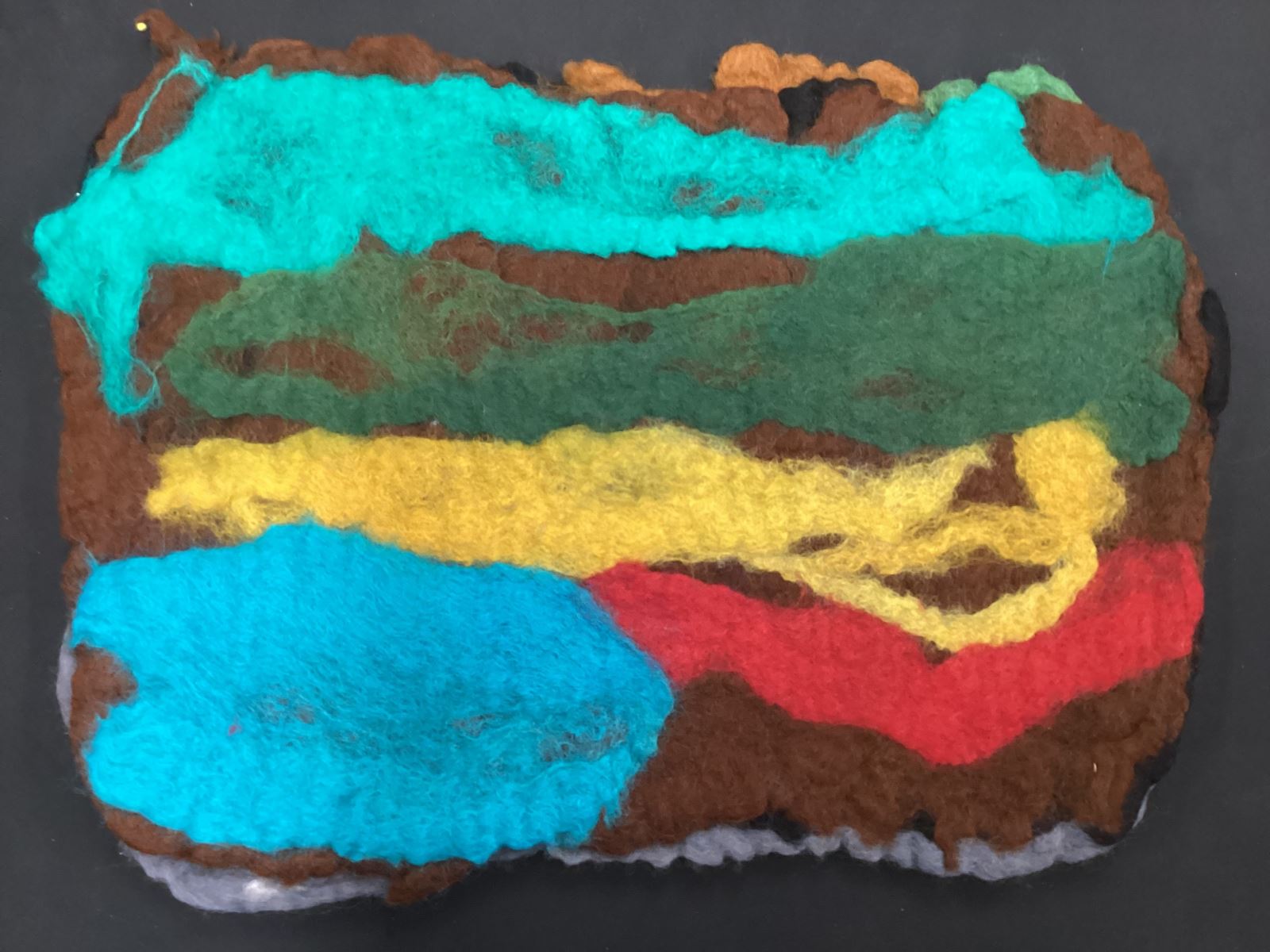 blue, green, red and yellow stripes on a brown background